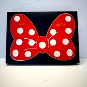 Girabella set of 8 lipsticks in a “Minnie Mouse bow” shaped box.